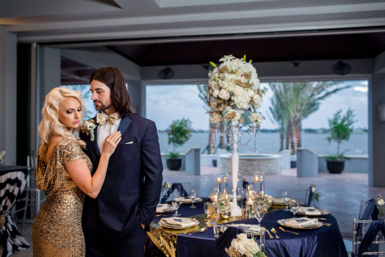 A man and woman in formal wear standing next to each other.