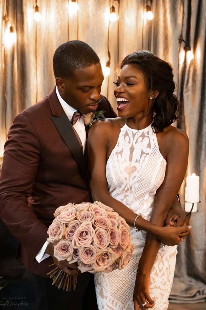 A man and woman posing for the camera.