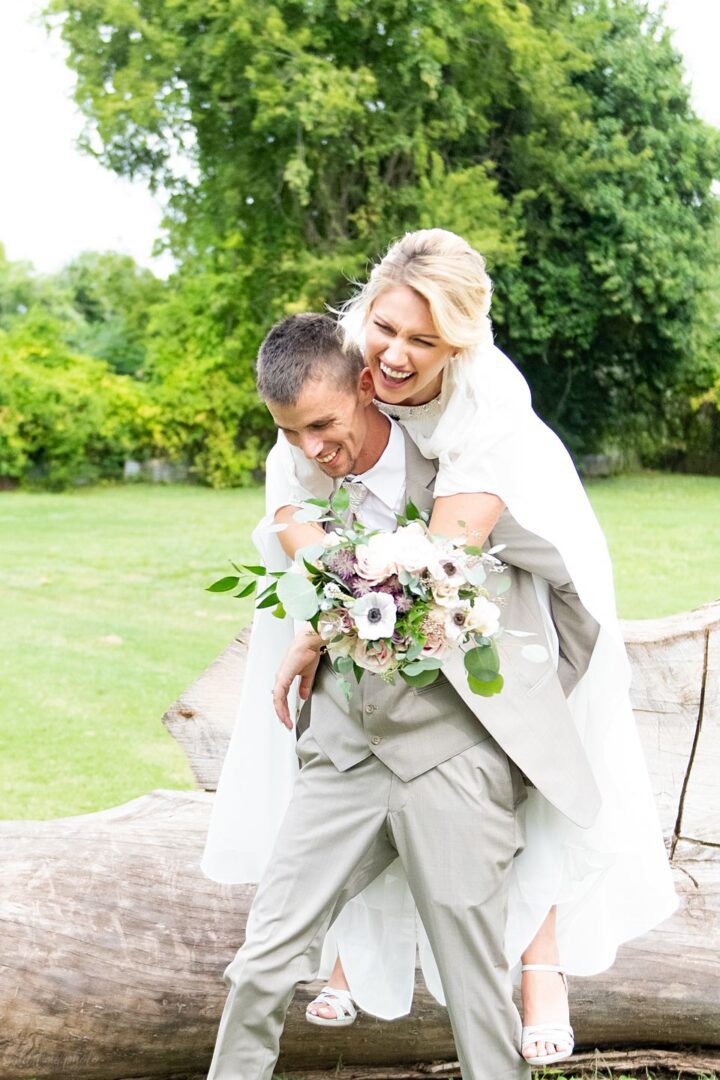 A man and woman are hugging outside