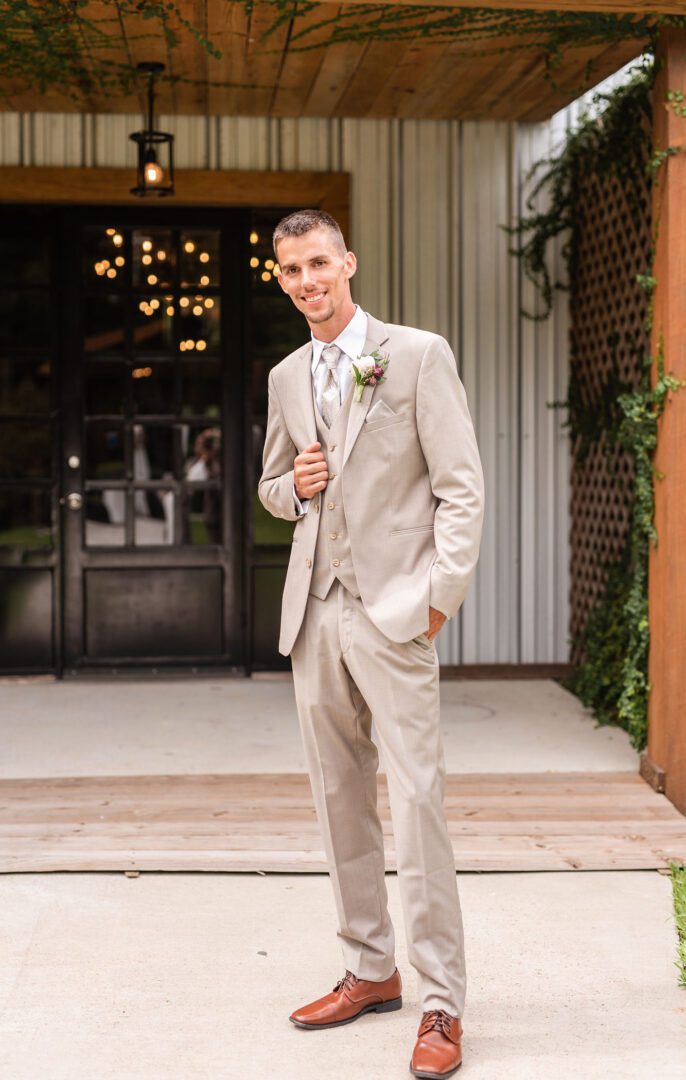 A man in a suit and tie standing outside.