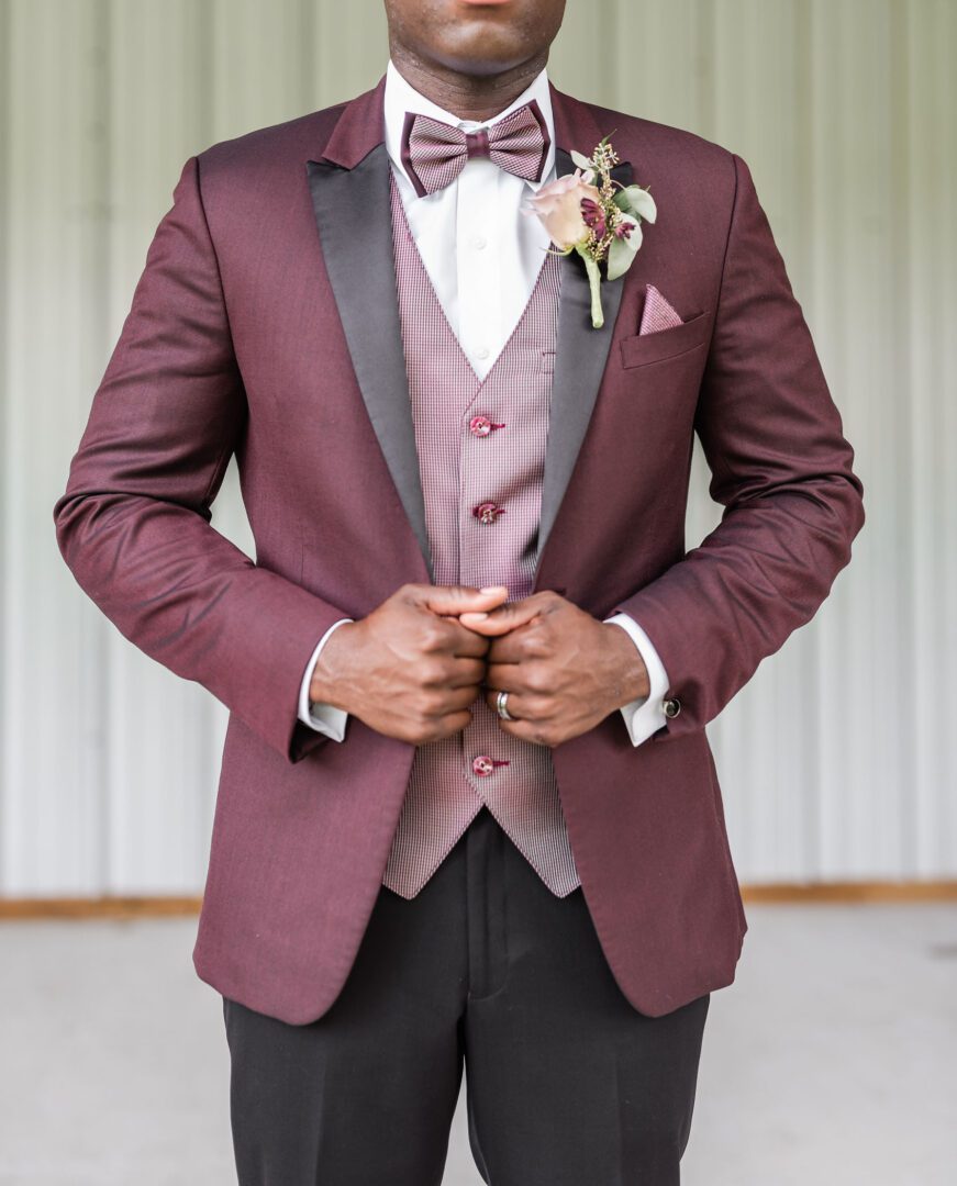 A man in a suit and bow tie.