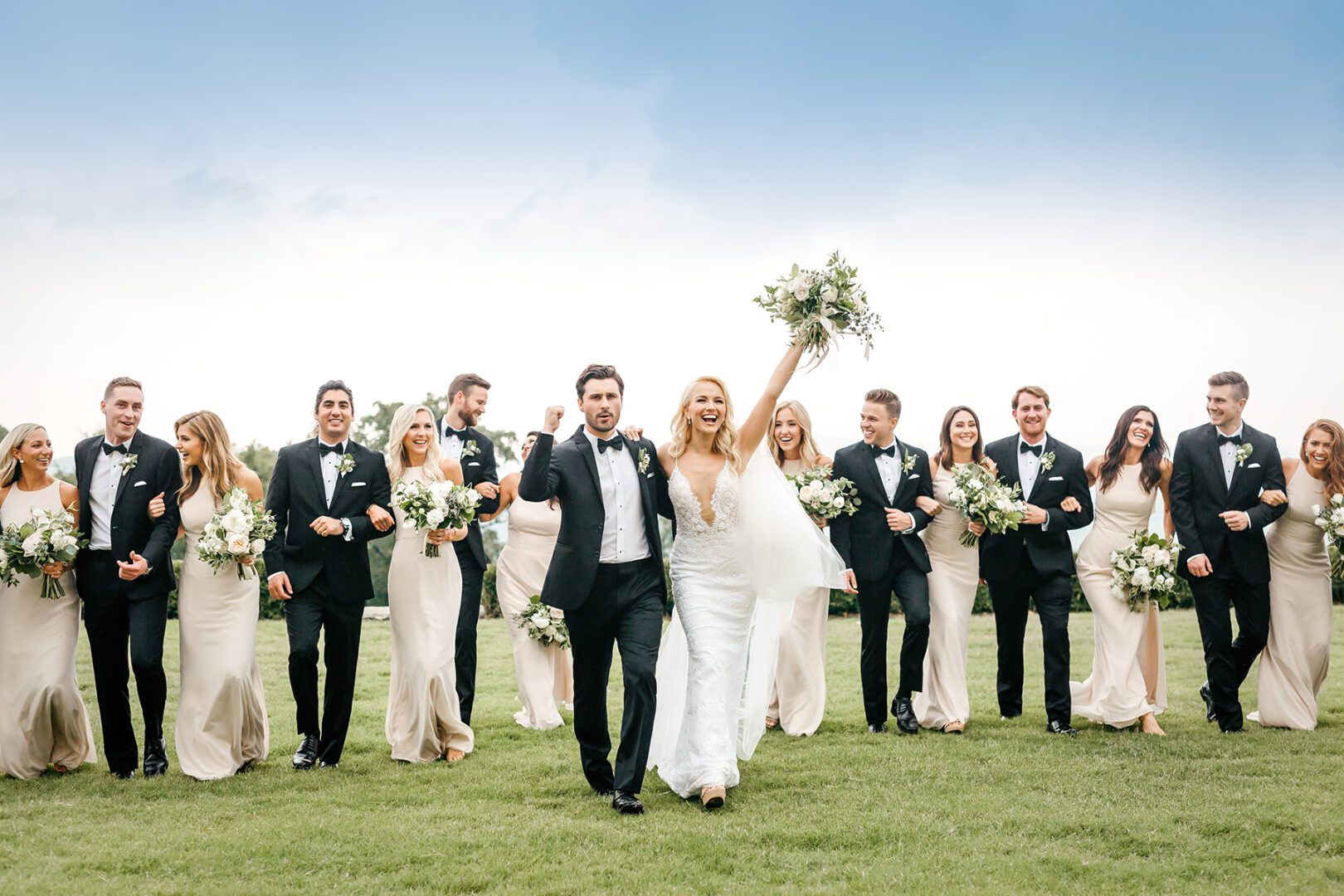 A group of people in suits and dresses