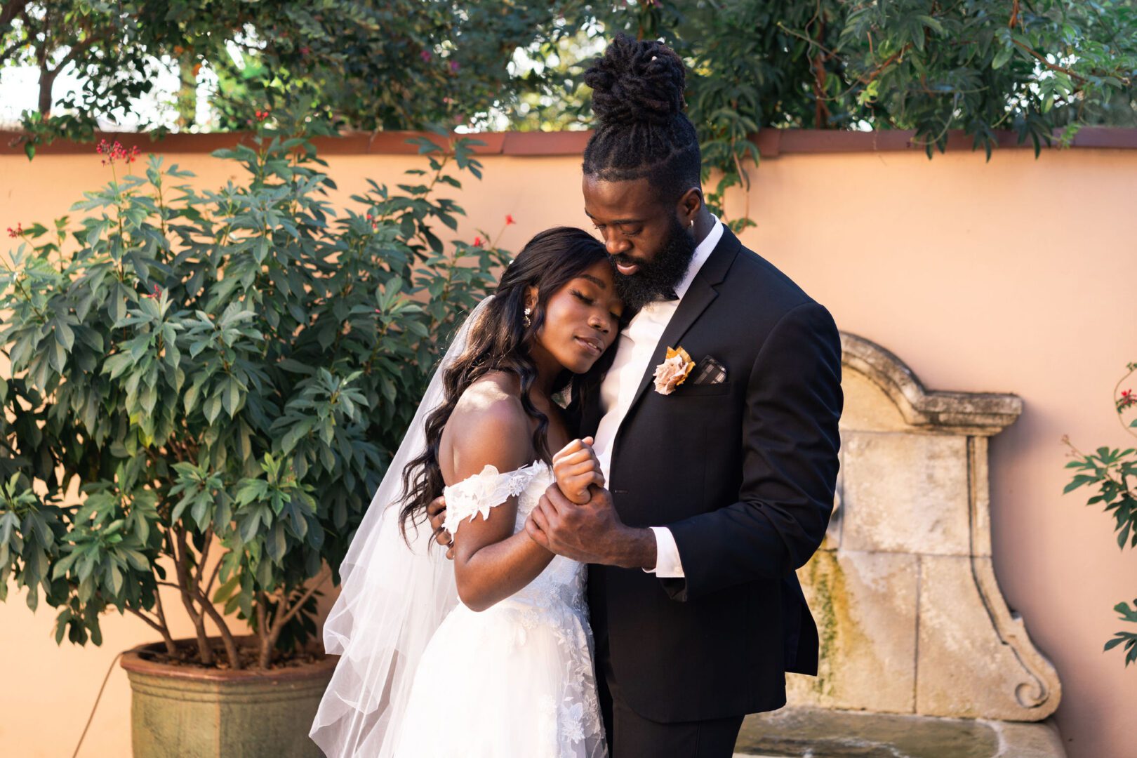 A man and woman are posing for the camera.