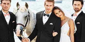 A man and woman posing for a picture with a horse.