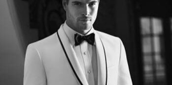 A man in a tuxedo and bow tie.